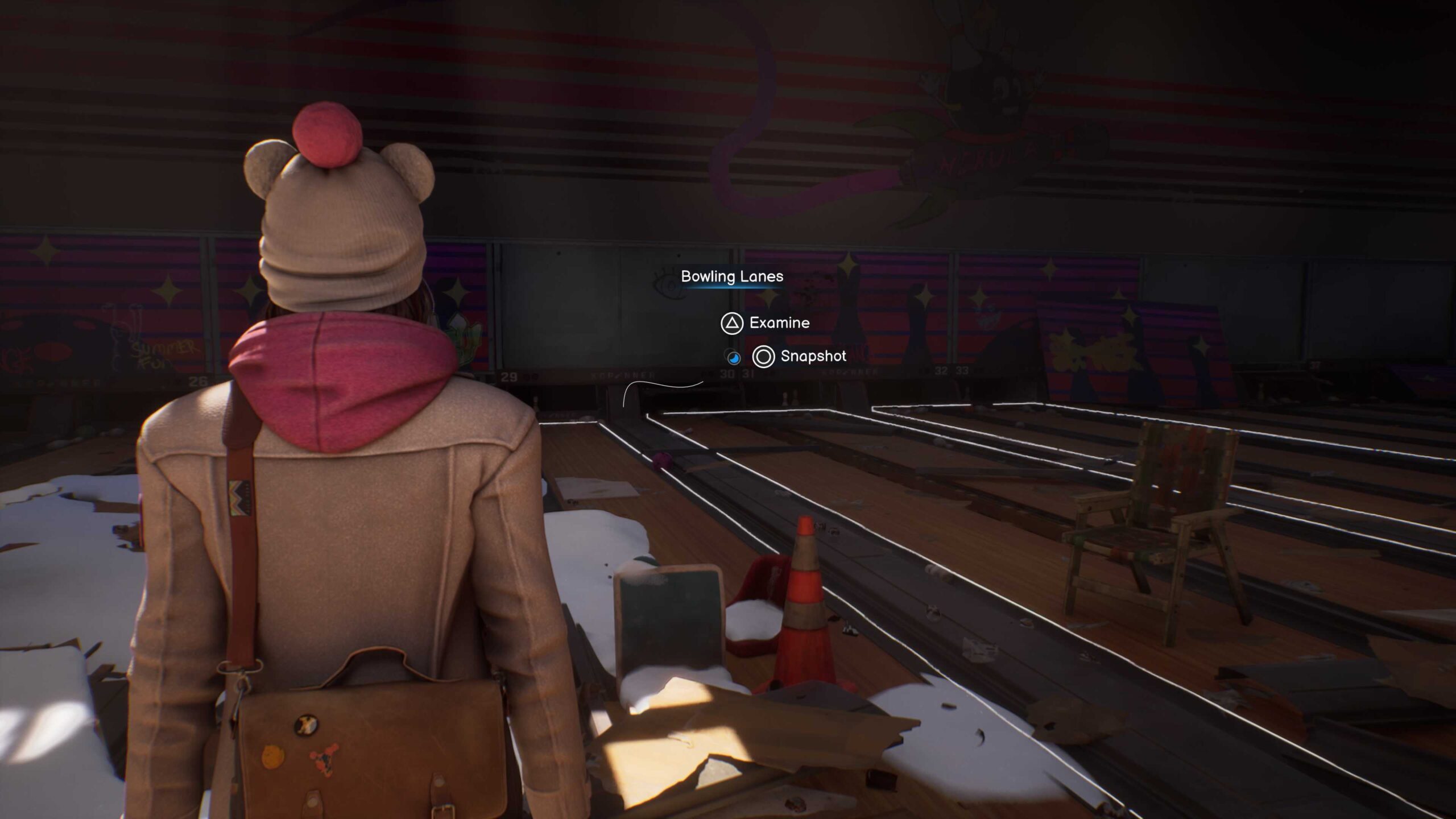 The bowling alley scene after changes made from play testing findings: The reworked interaction prompt is now scaled up and the interaction outlines becomes more prominent.